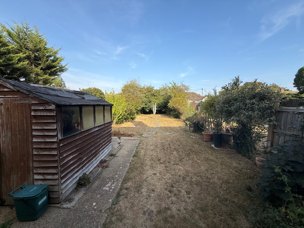 Lot: 226 - THREE-BEDROOM SEMI-DETACHED HOUSE FOR IMPROVEMENT - Overview of Garden with grass and shed